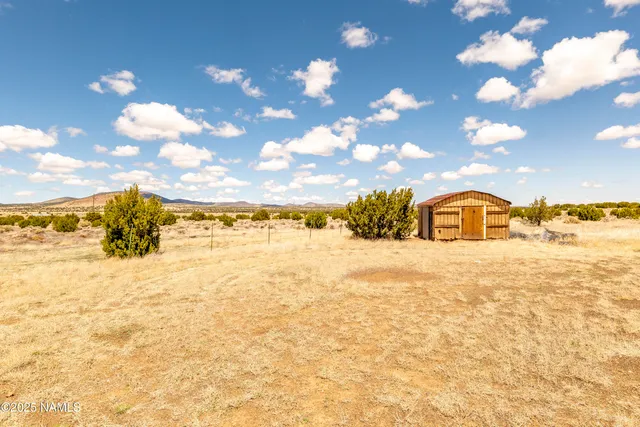 a view of a pathway with a yard