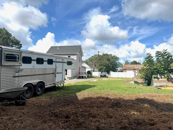 a view of a big house with a big yard