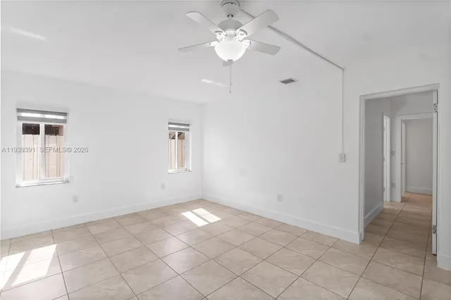 a view of an empty room with a window