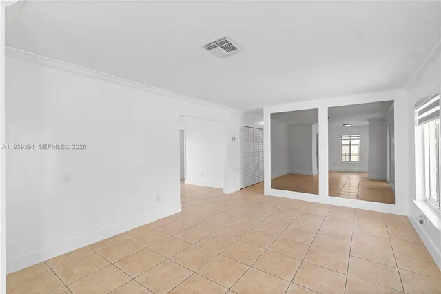 a view of an empty room and window