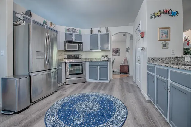 a living room with furniture a fireplace and a window