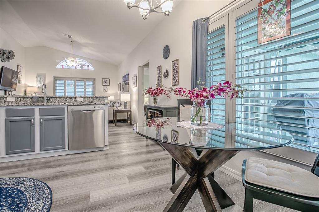 4802 Summerbridge Circle Leesburg, FL 34748 - Photo 13 of 67 a view of a dining room with furniture and chandelier