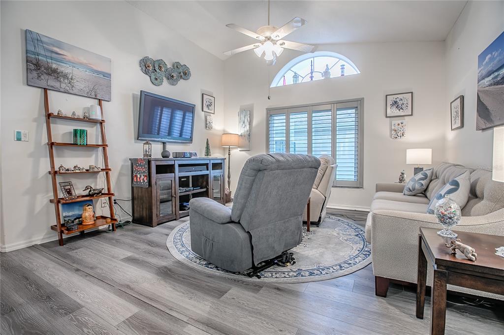4802 Summerbridge Circle Leesburg, FL 34748 - Photo 15 of 67 a living room with furniture a fireplace and a window