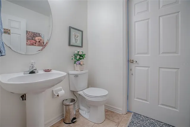 a bathroom with a toilet and shower