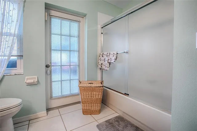 a bathroom with a tub and shower
