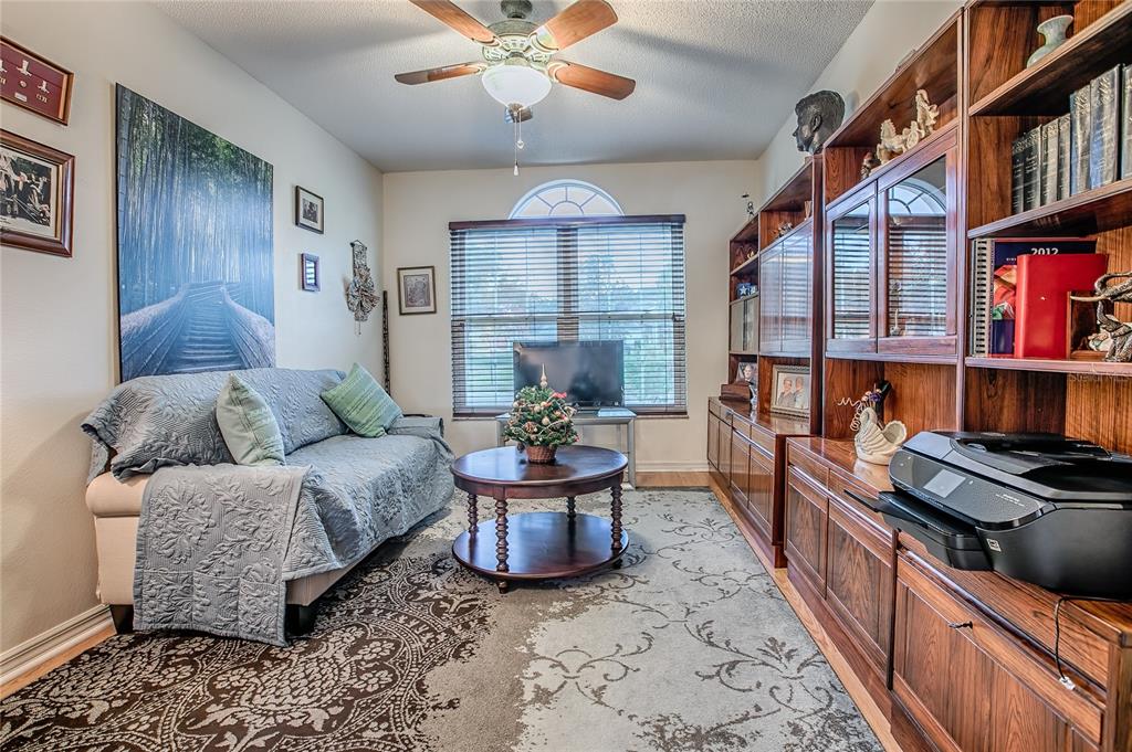 4802 Summerbridge Circle Leesburg, FL 34748 - Photo 28 of 67 a living room with furniture and a chandelier