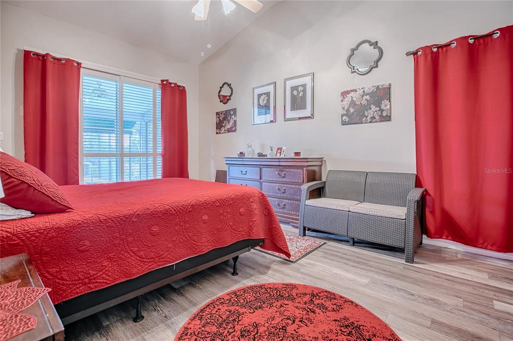 4802 Summerbridge Circle Leesburg, FL 34748 - Photo 30 of 67 a bedroom with a bed and a couch