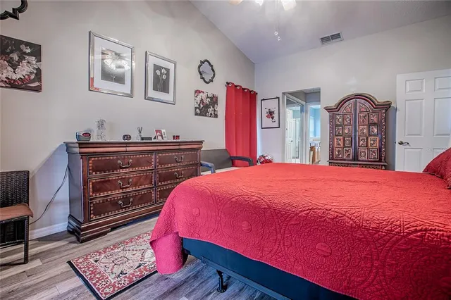 a living room with furniture a fireplace and a floor to ceiling window