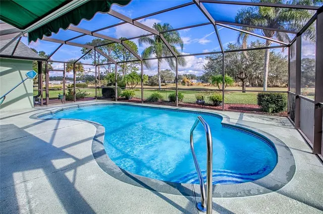 an aerial view of a house with garden space and ocean view