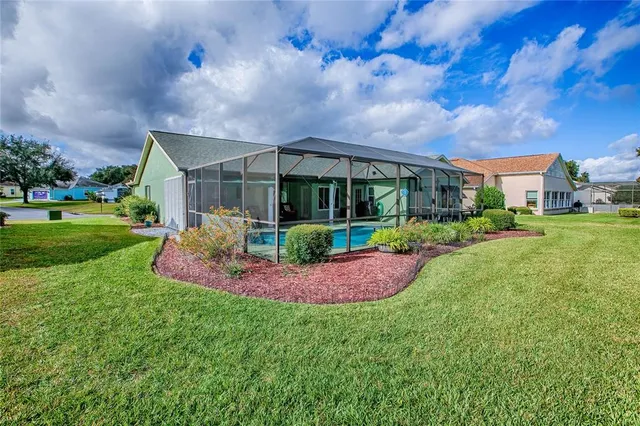 an aerial view of residential house with outdoor space and lake view