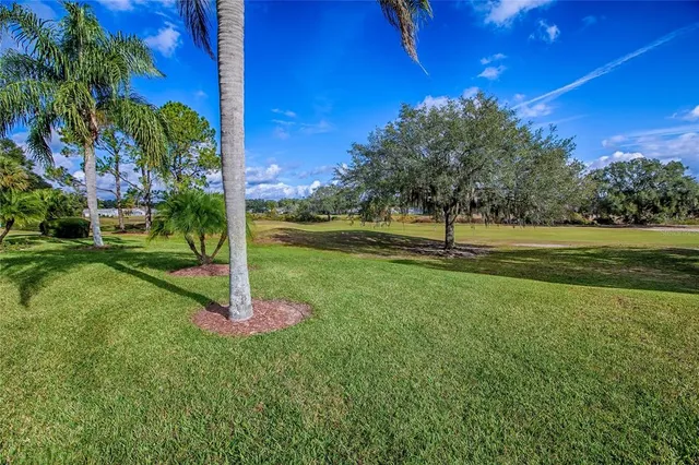 an aerial view of residential house with outdoor space and lake view