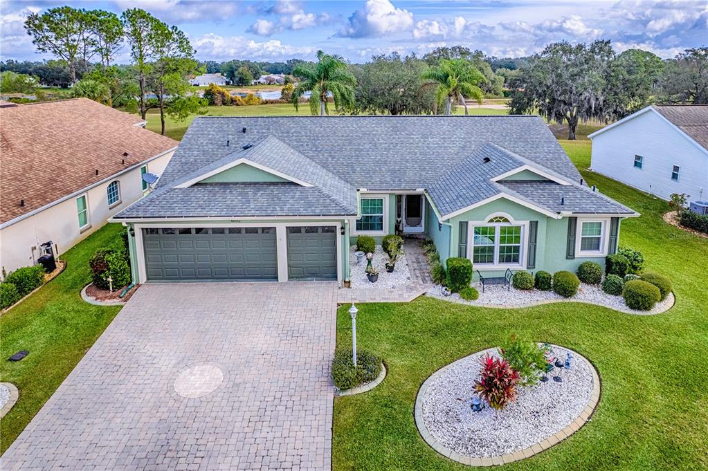 4802 Summerbridge Circle Leesburg, FL 34748 - Photo 49 of 67 a front view of a house with a yard and garage