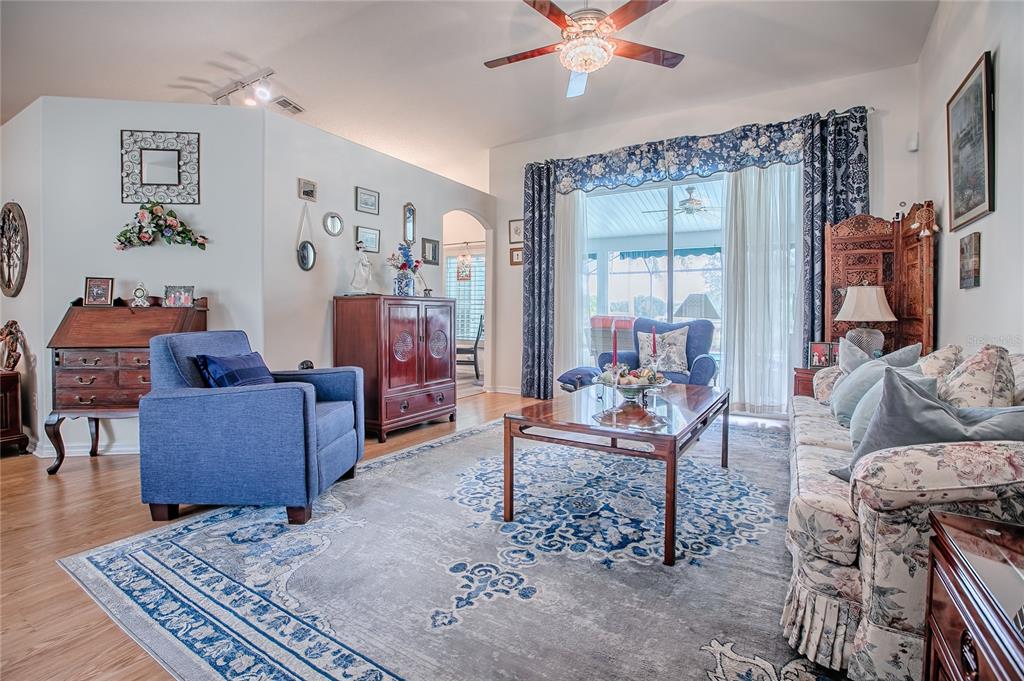 4802 Summerbridge Circle Leesburg, FL 34748 - Photo 5 of 67 a living room with furniture and a rug