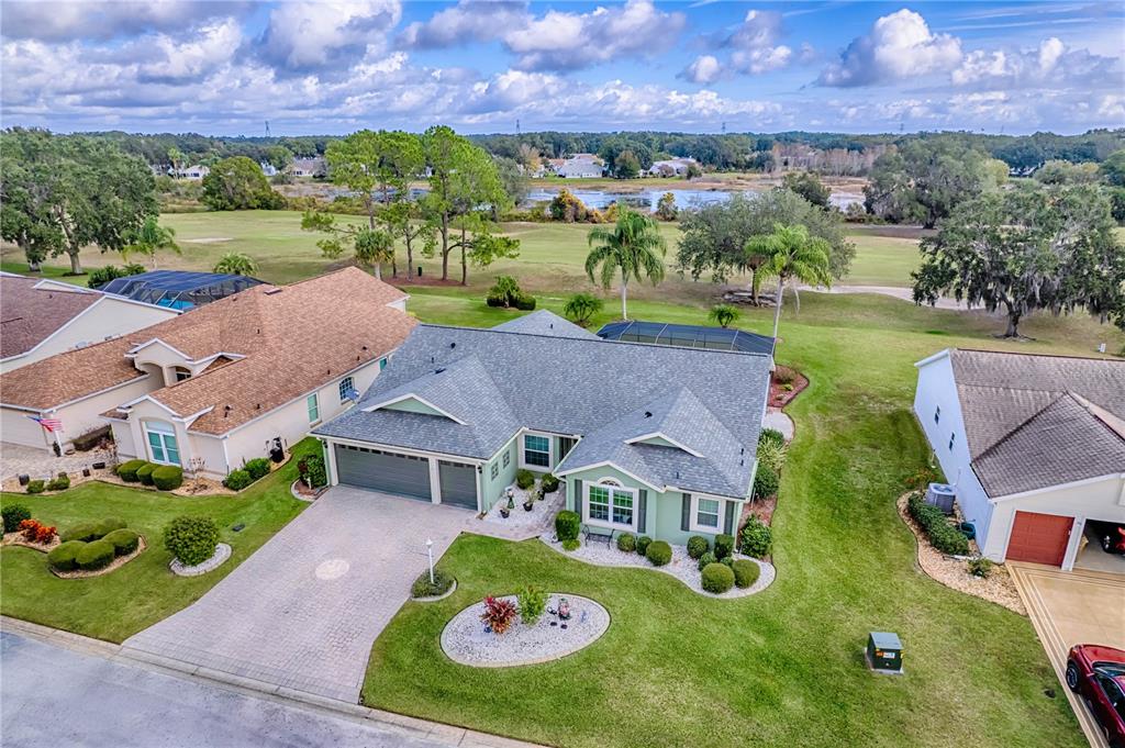 4802 Summerbridge Circle Leesburg, FL 34748 - Photo 51 of 67 an aerial view of a house with garden space and ocean view