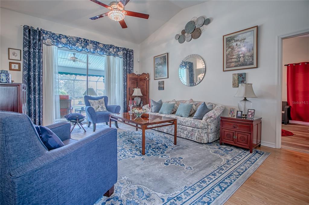 4802 Summerbridge Circle Leesburg, FL 34748 - Photo 6 of 67 a living room with furniture and a large window