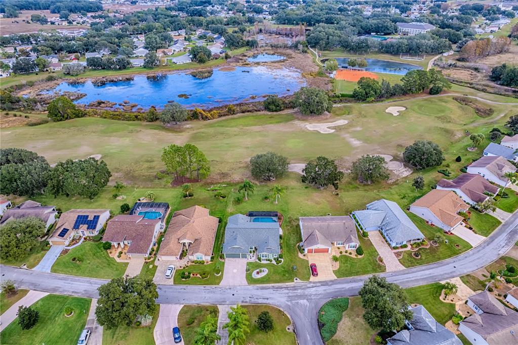 4802 Summerbridge Circle Leesburg, FL 34748 - Photo 63 of 67 an aerial view of residential houses with outdoor space and river