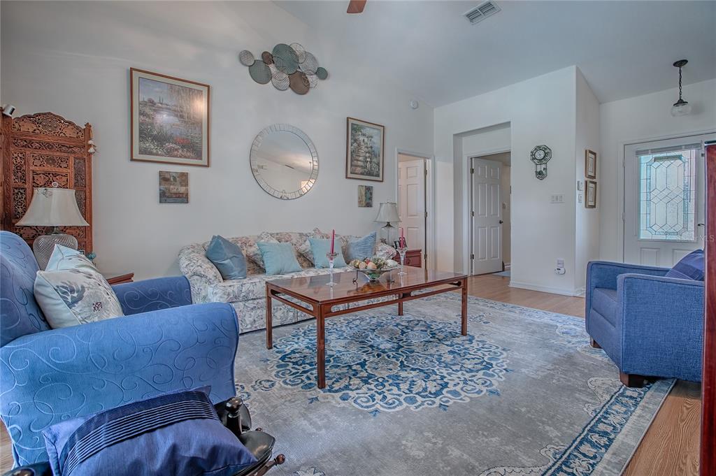 4802 Summerbridge Circle Leesburg, FL 34748 - Photo 7 of 67 a living room with furniture and a window