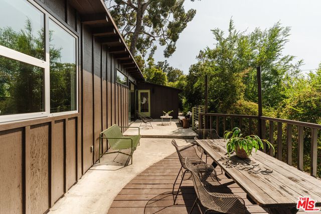 a view of balcony with furniture