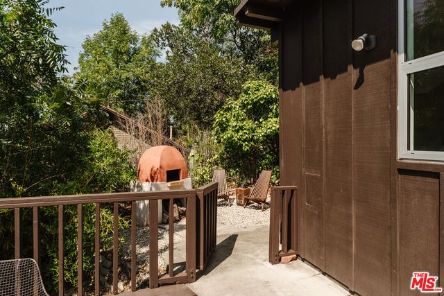 a view of a wooden house with a large window
