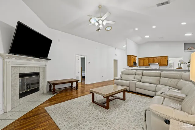 a living room with furniture and a fireplace