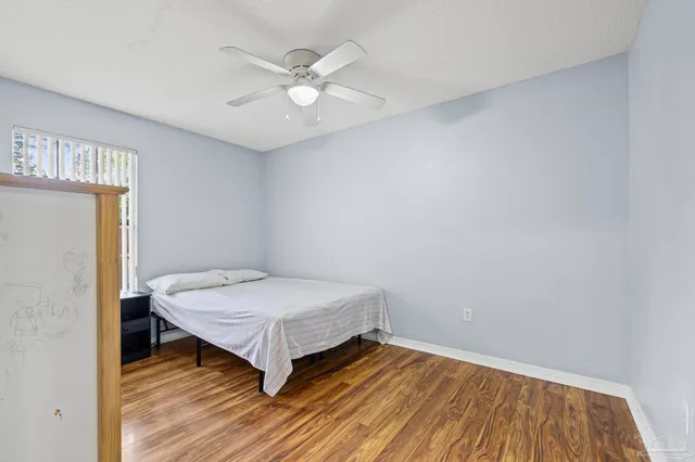 a room with a bed and a chandelier