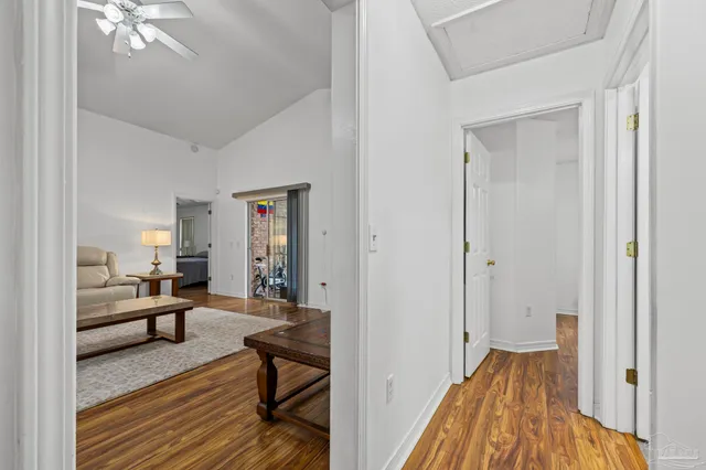 a view of a livingroom with furniture and hardwood floor