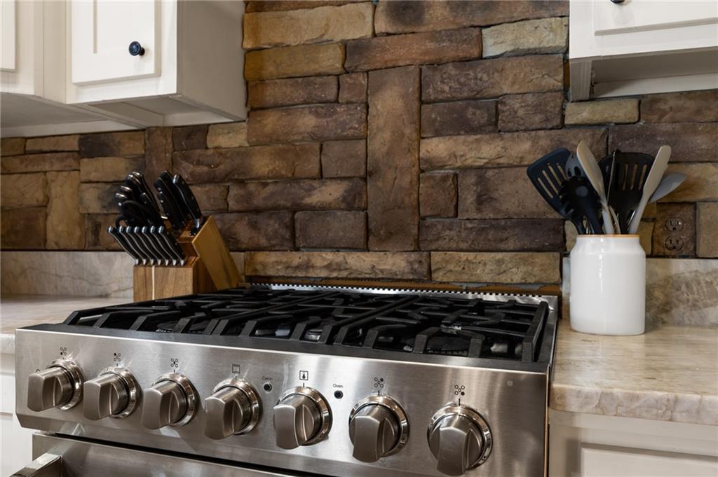 454 High Country Lane Morganton, GA 30560 - Photo 21 of 79 a close view of a stove top oven sitting inside of a kitchen