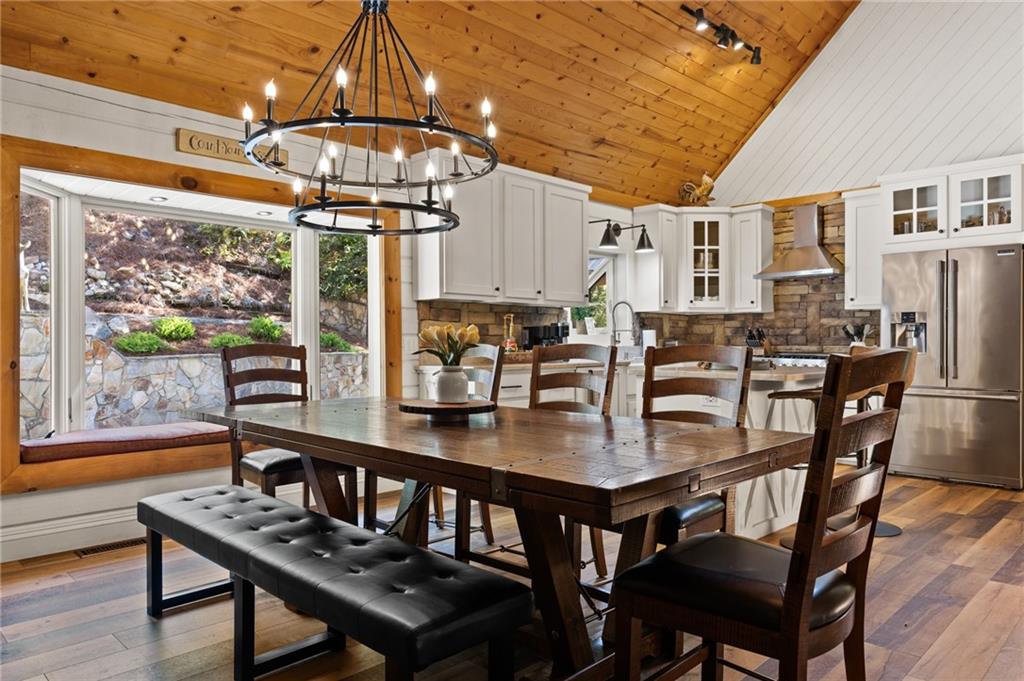 454 High Country Lane Morganton, GA 30560 - Photo 23 of 79 a view of a dining room with furniture window and wooden floor