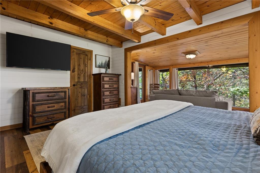 454 High Country Lane Morganton, GA 30560 - Photo 37 of 79 a spacious bedroom with a bed and a flat screen tv