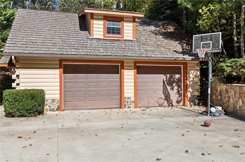 454 High Country Lane Morganton, GA 30560 - Photo 78 of 79 a front view of a house with a yard and garage