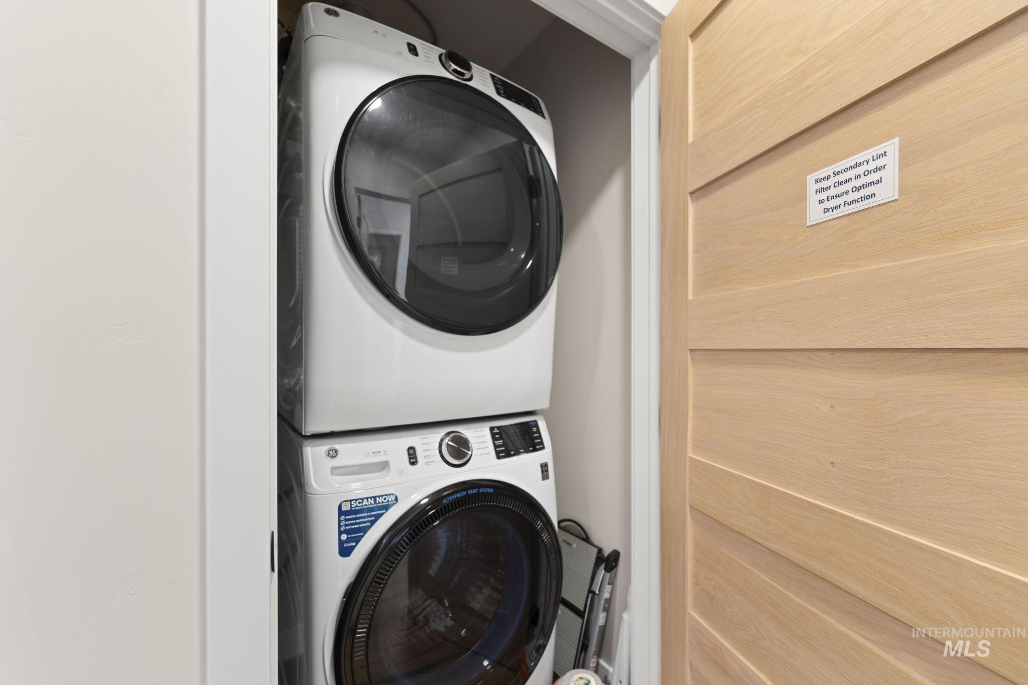 720 Village Drive, Unit 301 Donnelly, ID 83615 - Photo 29 of 43 Washroom with stacked washing machine and dryer