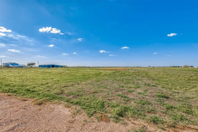 a view of an ocean and a yard