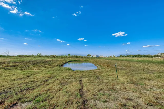 a view of an ocean and a yard