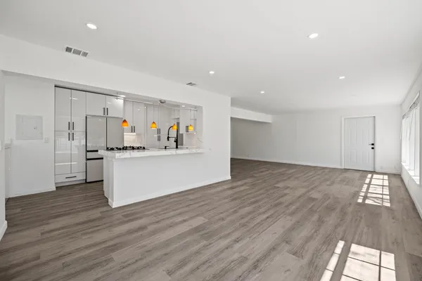 a view of kitchen with wooden floor