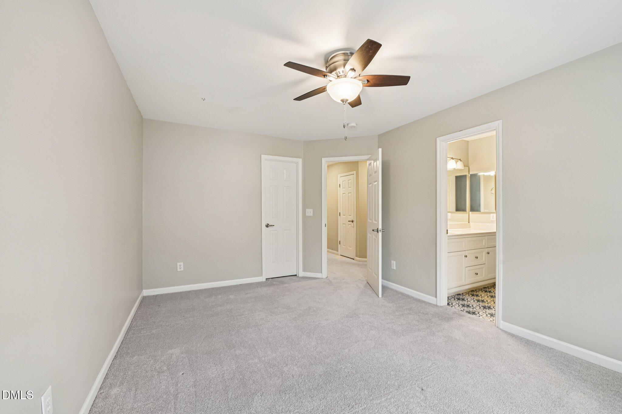 13100 Townfield Drive Raleigh, NC 27614 - Photo 18 of 31 an empty room with closet and windows