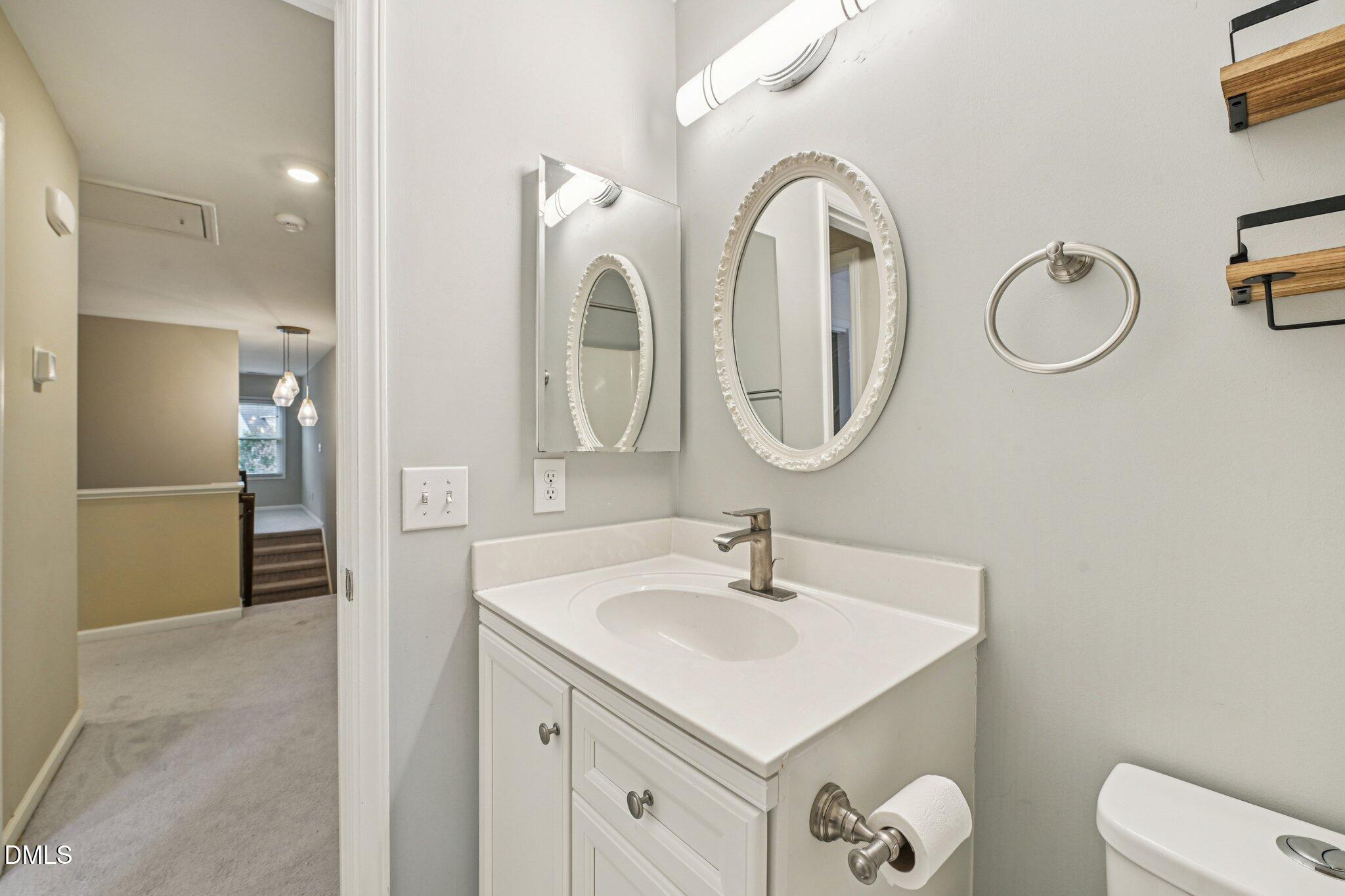 13100 Townfield Drive Raleigh, NC 27614 - Photo 20 of 31 a bathroom with a sink and a mirror