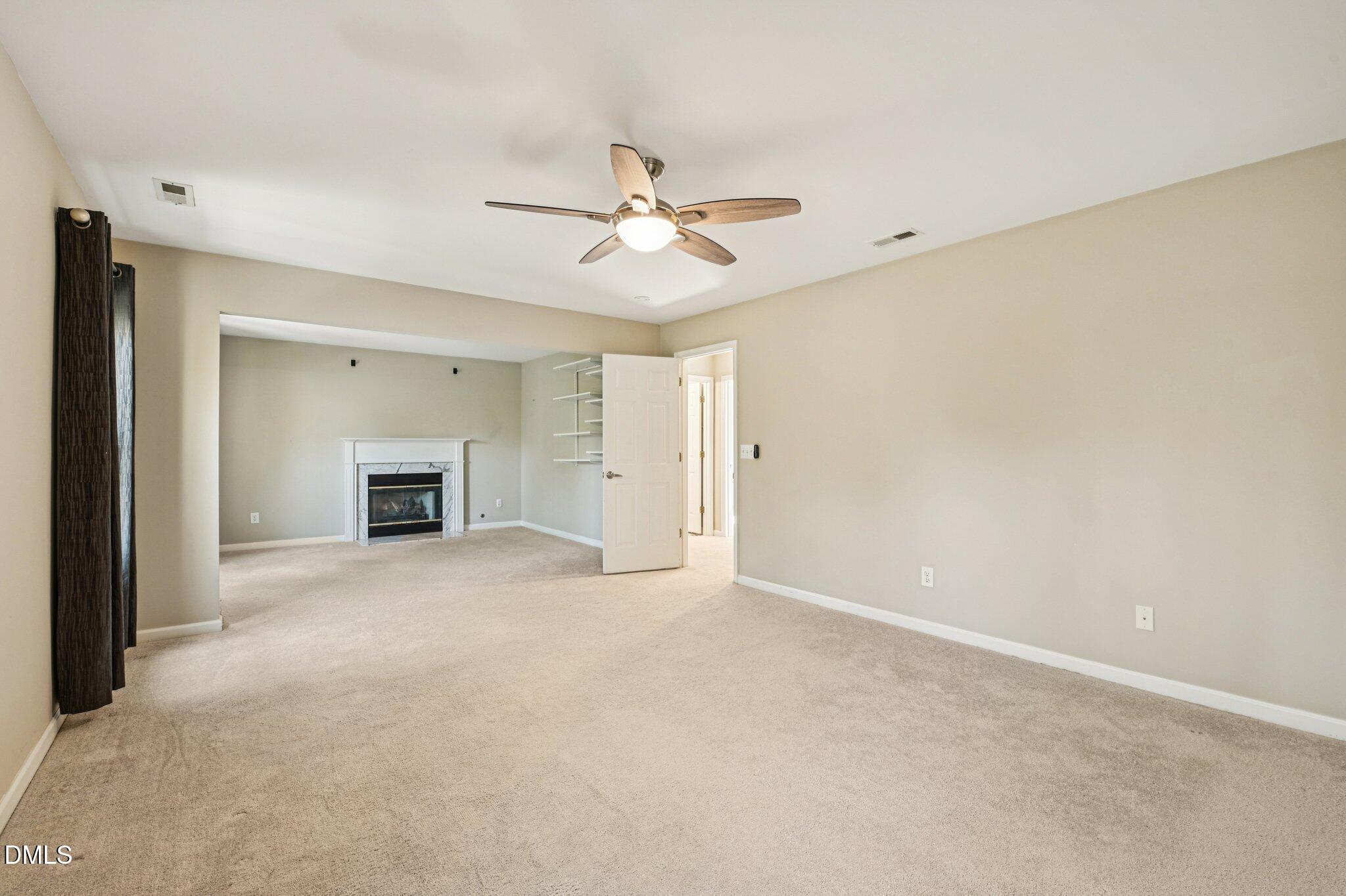 13100 Townfield Drive Raleigh, NC 27614 - Photo 23 of 31 a view of empty room with a ceiling fan and a window
