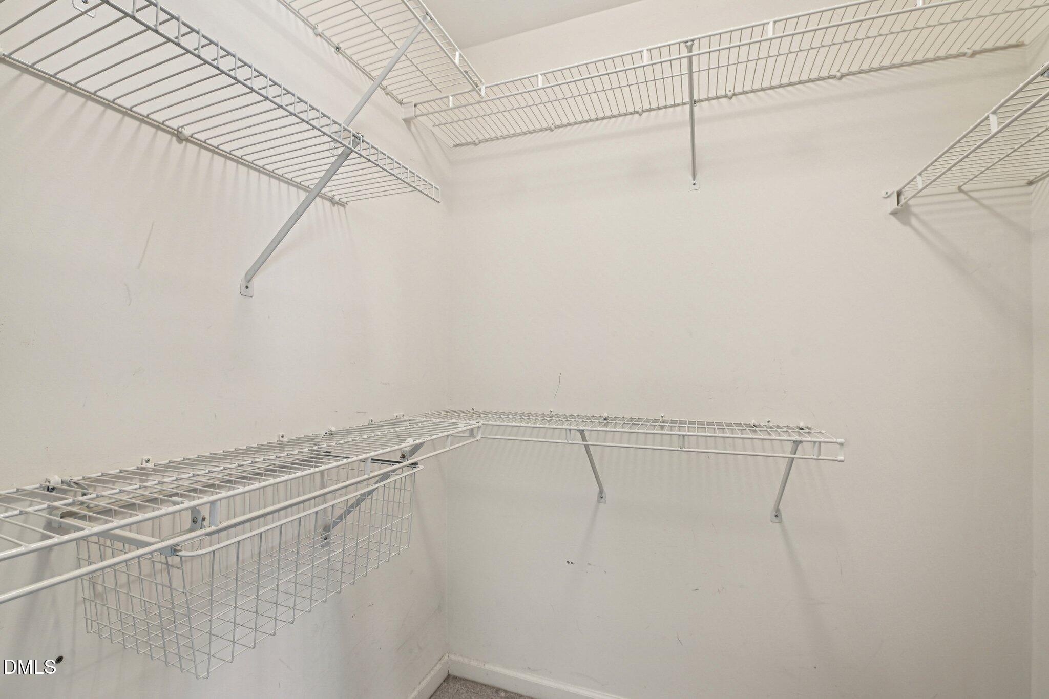 13100 Townfield Drive Raleigh, NC 27614 - Photo 24 of 31 a view of a room with racks on the wall