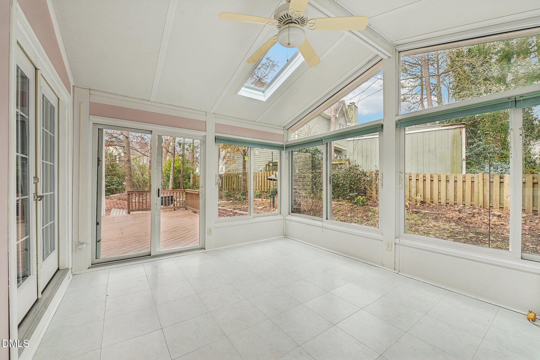 13100 Townfield Drive Raleigh, NC 27614 - Photo 27 of 31 a view of an empty room with wooden floor and a window