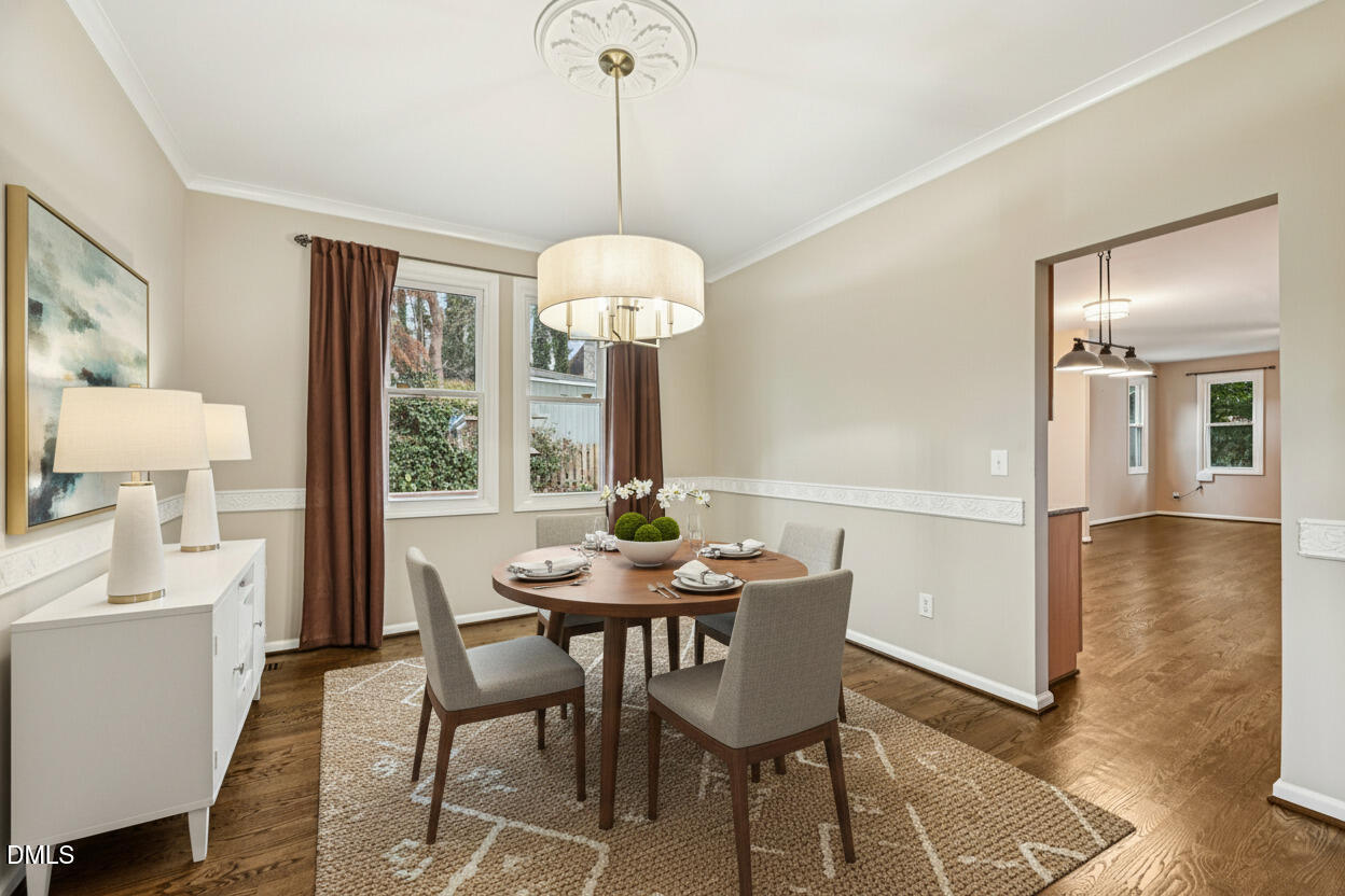 13100 Townfield Drive Raleigh, NC 27614 - Photo 3 of 31 a view of a dining room with furniture wooden floor and chandelier