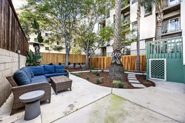 a view of a backyard with sitting area