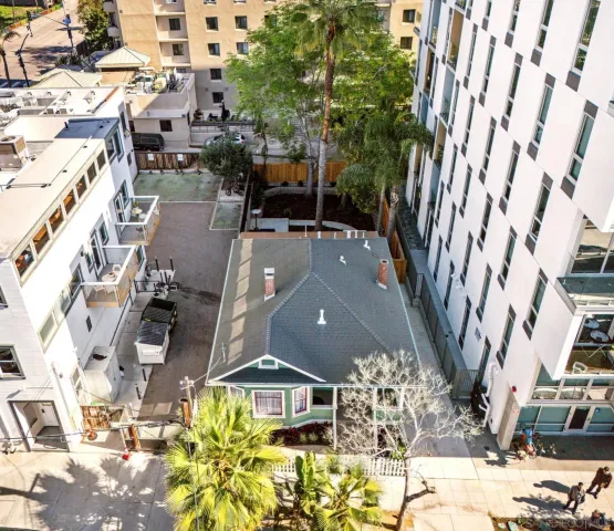 a view of multiple houses with a street