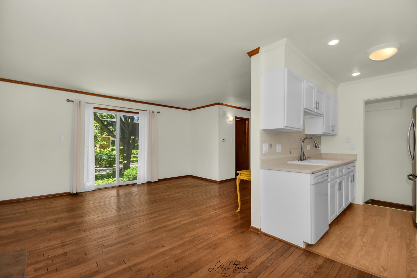 417 Sunnybrook Lane Wheaton, IL 60187 - Photo 5 of 17 a kitchen with wooden floors and sink