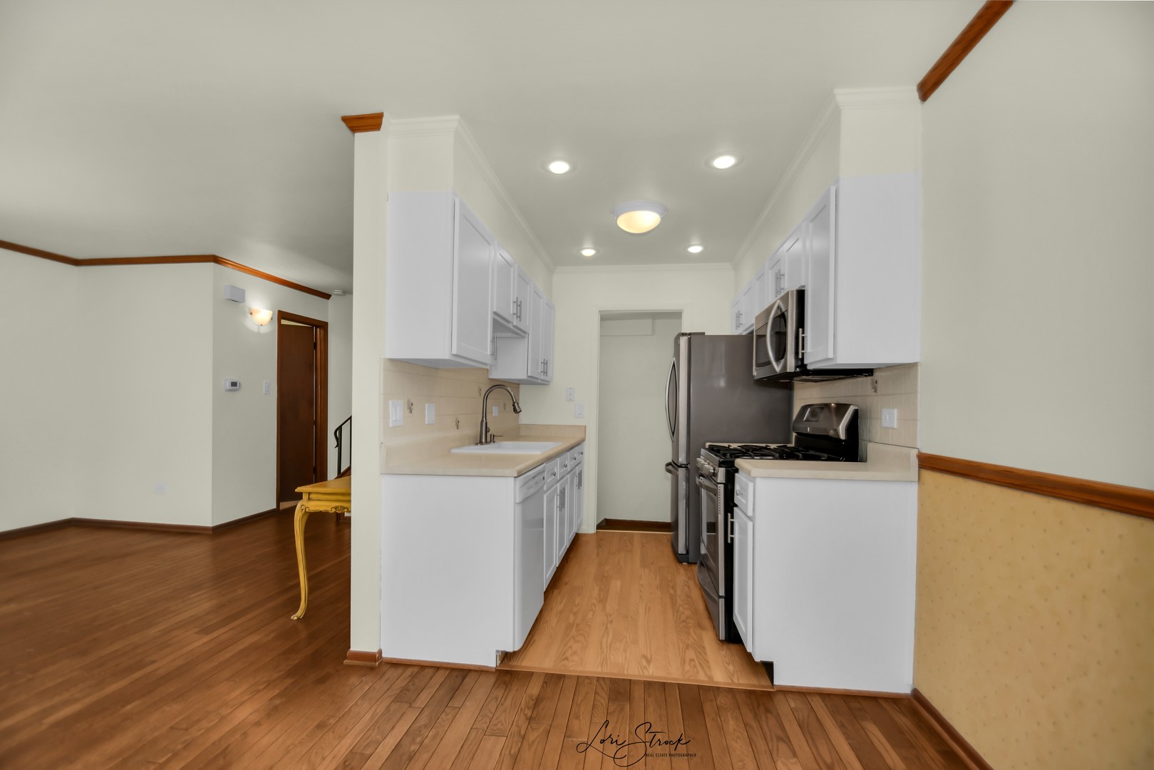 417 Sunnybrook Lane Wheaton, IL 60187 - Photo 8 of 17 a kitchen with stainless steel appliances a refrigerator and a stove top oven