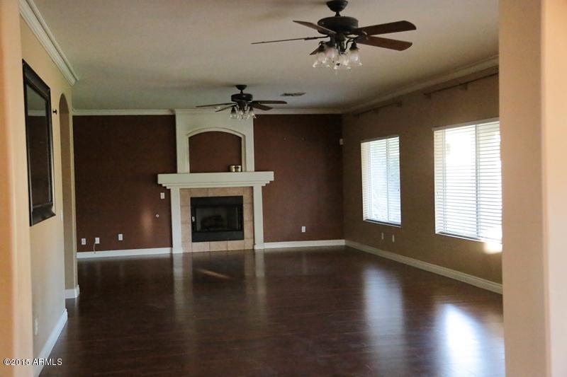 2159 East Victor Road Gilbert, AZ 85296 - Photo 7 of 47 family room with fire place