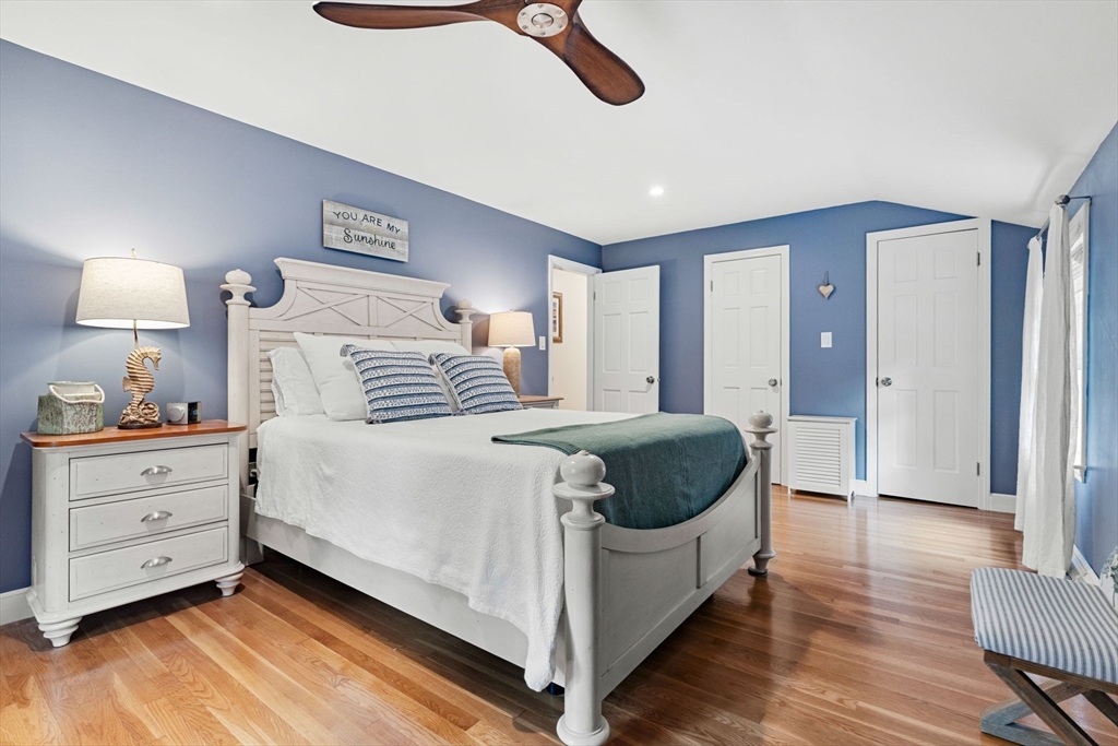 1 Valley Path Marshfield, MA 02050 - Photo 17 of 28 a spacious bedroom with a bed and a lamp