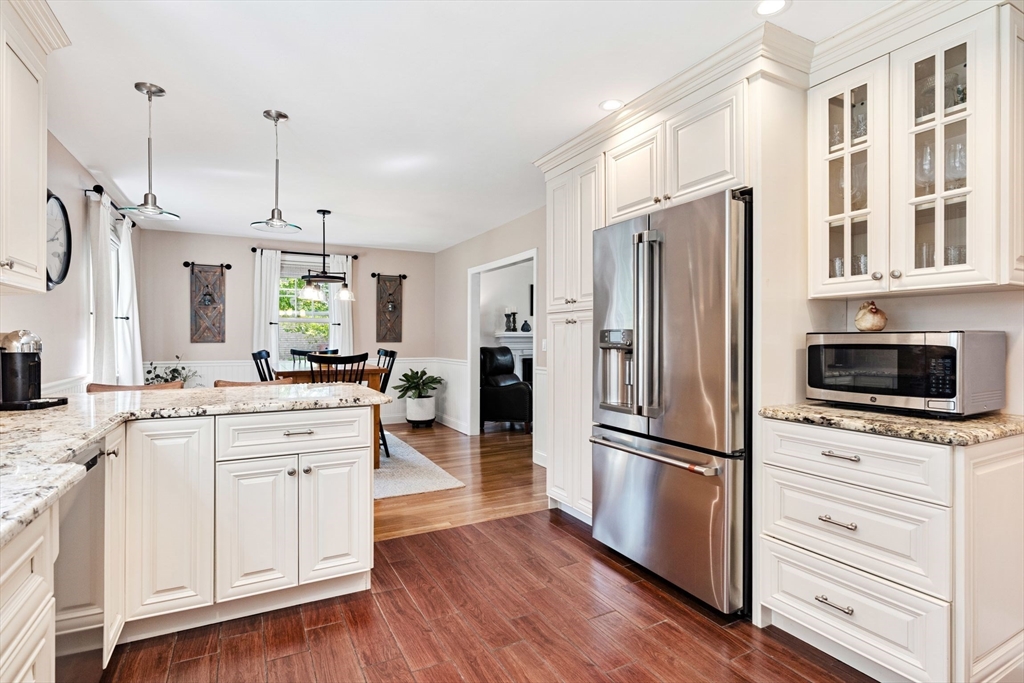 1 Valley Path Marshfield, MA 02050 - Photo 6 of 28 a kitchen with stainless steel appliances a refrigerator stove and sink
