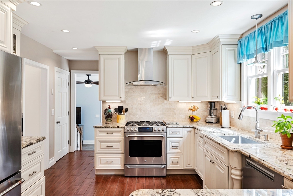 1 Valley Path Marshfield, MA 02050 - Photo 7 of 28 a kitchen with granite countertop white cabinets and white appliances
