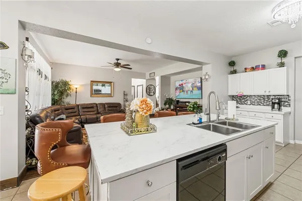 a kitchen with stainless steel appliances granite countertop a sink and cabinets