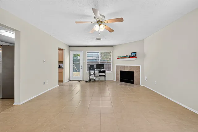 a kitchen with granite countertop a stove a sink and a microwave